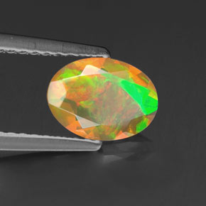 0.69 ct Multicolor Opal Stone, Natural Opal in Oval Facet Shape for Sale