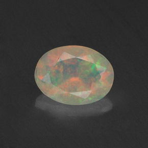 0.74 ct Multicolor Opal Gemstone, Opal Gem in Oval Facet Shape for Sale.