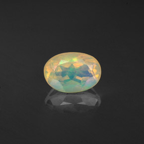 0.59 ct Multicolor Opal Gemstone, Opal Gem in Oval Facet Shape for Sale.
