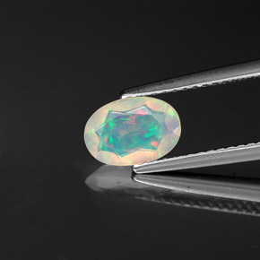 0.57 ct Multicolor Opal Gemstone, Opal Gem in Oval Facet Shape for Sale.