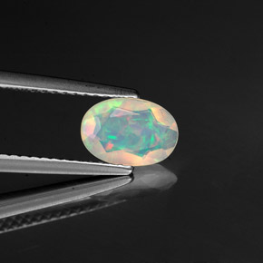 0.57 ct Multicolor Opal Stone, Natural Opal in Oval Facet Shape for Sale