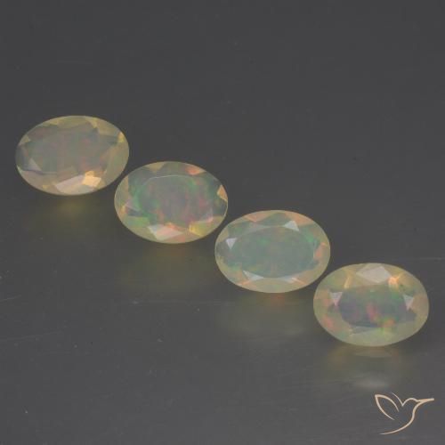4-teiliges ovaler mehrfarbiger Opal / Set aus Äthiopien - Gewicht 1,48 ct gesamt / Durchschn. je 0,37 ct, Größe 7,1 x 5mm, Farbe: Mehrfarbig, Mohs-Härte 5,5 - 6,5, Symbolisiert Liebe, Leidenschaft, Verlangen, Photo A