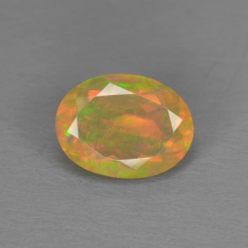Ópalo Multicolor Forma ovalada de 0.74 ct de Etiopía, dimensión 8,1 x 6,1mm, piedra preciosa natural No tratado, claridad Translúcido, Ópalo de 1 pieza en color Multicolor, dureza Mohs de 5.5 - 6.5, Simboliza el amor, la pasión, el deseo, Photo A