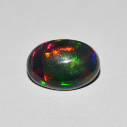 0.78ct Oval Cabochon Multicolor Opal from Ethiopia, Dimension 8.9 x 6.2mm, Natural smoked Gemstone, Opaque Clarity, 1 piece Opal in Multicolor Color, Mohs Hardness of 5.5 - 6.5, Year of the Snake Gemstone, Photo A