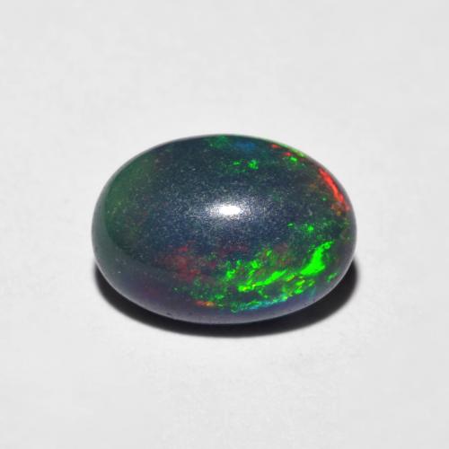 Opale Multicolore oval cabochon 0,94 ct d'Éthiopie, dimension 8,6 x 6,2mm, pierre gemme naturelle Fumé, pureté Translucide, 1 pièce Opale de couleur Multicolore, dureté Mohs de 5.5 à 6.5, Pierre de naissance d'octobre, Photo A