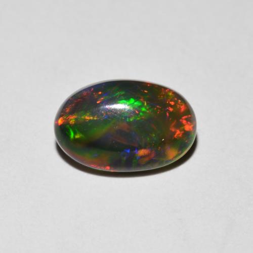 Multicolore Opale Gem - 0.7ct Ovale cabochon (ID: 615734)