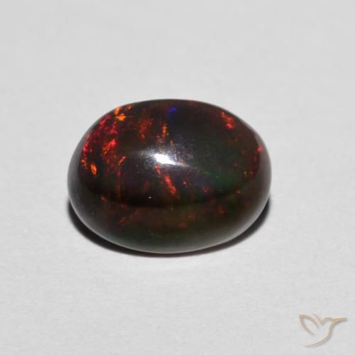 Opale Multicolore Ovale 0,68 ct d'Éthiopie, Dimension 7,8 x 5,9mm, Pierre gemme naturelle Fumé, pureté Translucide, 1 pièce d'opale oval cabochon, dureté de Mohs de 5.5 à 6.5, Année de la pierre précieuse du serpent, Photo A