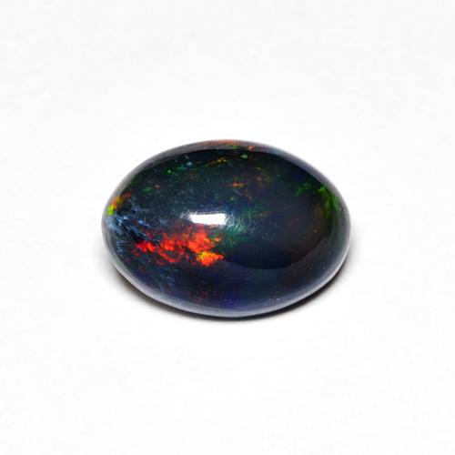 7 x 5mm Opale multicolore taglio ovale dall'Etiopia, peso di 0,42 ct, pietra preziosa naturale Affumicato in purezza Opaque, 1 pezzo Opale Ovale cabochon - Colore: Multicolore, durezza Mohs di 5,5 - 6,5 , Pietra zodiacale Bilancia, Photo A