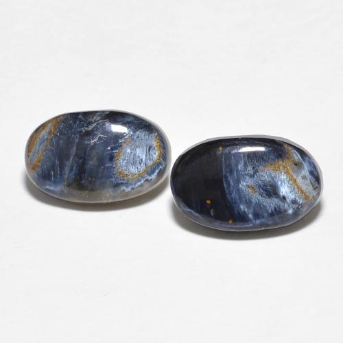 Coppia Pietersite Ovale abbinata 10,1 x 6,4mm - Peso 2,9 ct totali / media. 1,45 ct ciascuno, pietra preziosa naturale non trattati, colore Multicolore in purezza Opaque, durezza Mohs 6,5 - 7 adatto per gioielli da indossare ogni giorno, Photo A