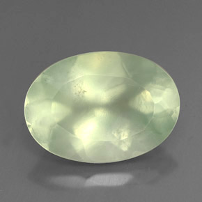 5.71 ct Green Prehnite Gemstone, Prehnite Gem in Oval Facet Shape for Sale.