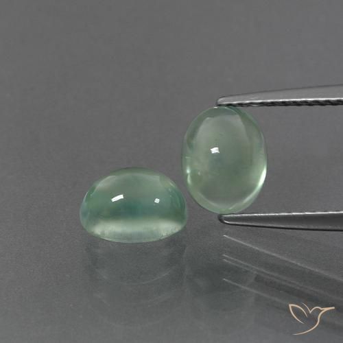 2 pezzi Prehnite verde Ovale abbinato di dimensioni 7,5 x 5,8mm, peso 3,18 ct totali / media. 1,59 ct ciascuno, giallo in purezza Transparent, gemma naturale non trattati, durezza Mohs 6 - 6,5 , Photo A
