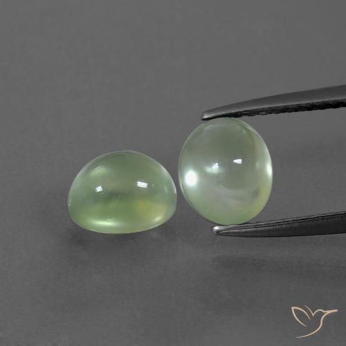 2 pezzi Prehnite taglio ovale abbinati di dimensioni 7,3 x 6,2mm, peso 2,91 ct totali / media. 1,46 ct ciascuno, Verde lime chiaro in purezza Transparent, pietra preziosa naturale non trattati, durezza Mohs 6 - 6,5, Photo A