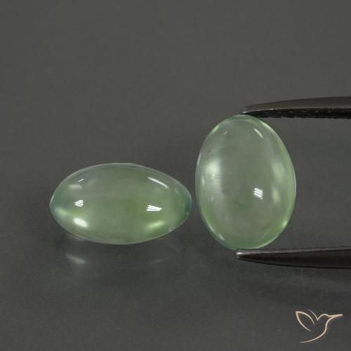 Coppia Prehnite Ovale abbinata 9,2 x 6,5mm - Peso 3,48 ct totali / media. 1,74 ct ciascuno, pietra preziosa naturale non trattati, colore Verde caldo in purezza Transparent, durezza Mohs 6 - 6,5, Photo A