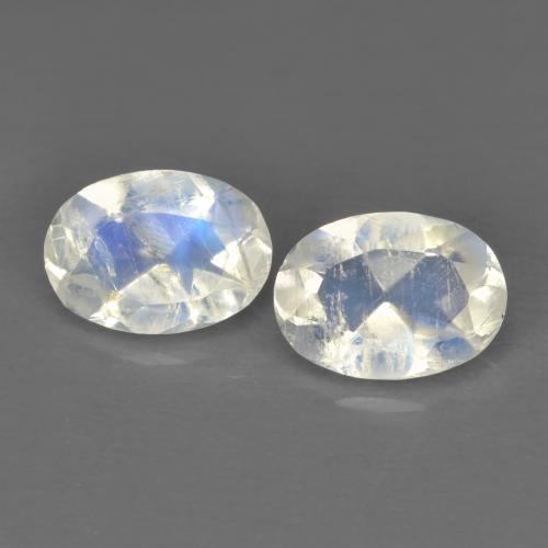 2pc Matching Oval White Rainbow Moonstones in Size 6.9 x 5mm, Weight 1.28ct total / avg. 0.64ct each, Bluish White in Transparent Clarity, Natural untreated Gemstone, Mohs Hardness 6 - 6.5, Photo A