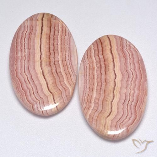 Coppia Rodocrosite taglio ovale da 20,9 x 12,8mm abbinati - Peso 23,82 ct totali / media. 11,91 ct ciascuno, colore Multicolore in purezza Translucent, pietra preziosa naturale non trattati, durezza Mohs 4 - 4, Photo A