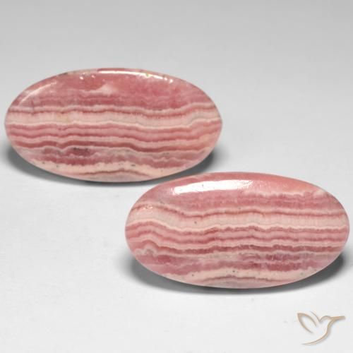 Coppia Rodocrosite taglio ovale da 21,6 x 11,3mm abbinati - Peso 21,59 ct totali / media. 10,8 ct ciascuno, colore Multicolore in purezza Translucent, pietra preziosa naturale non trattati, durezza Mohs 4 - 4, Photo A