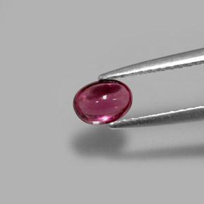 0.69 ct Violet Rhodolite Garnet Gemstone, Rhodolite Garnet Gem in Oval Cabochon Shape for Sale.