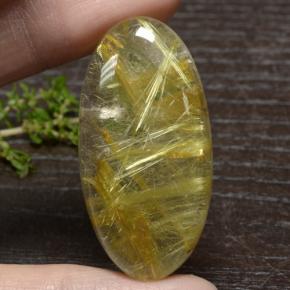 51.3ct Oval Cabochon Colorless Golden Rutile Quartz Gem for sale 51.3ct Oval Cabochon Colorless Golden Rutile Quartz Gem (ID: 472272)