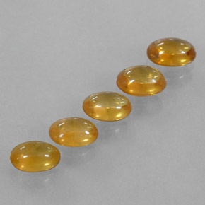 Dorado naranja intenso Zafiro Gema - 0.6ct Cabujón Óvalo (ID: 319630)
