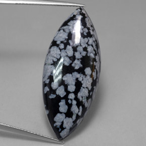 21.50 ct Multicolor Snowflake Obsidian Gemstone, Snowflake Obsidian Gem in Marquise Cabochon Shape for Sale.