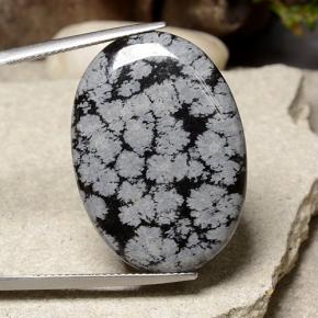 21.09 ct Multicolor Snowflake Obsidian Gemstone, Snowflake Obsidian Gem in Oval Cabochon Shape for Sale.