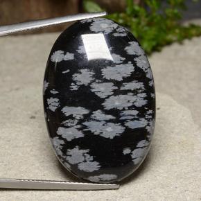 32.6ct Oval Cabochon Snowflake Snowflake Obsidian for sale thumb image of 32.6ct Oval Cabochon Snowflake Snowflake Obsidian (ID: 485638)