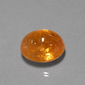 5.08 ct Orange Spessartite Garnet Gemstone, Spessartite Garnet Gem in Oval Cabochon Shape for Sale.