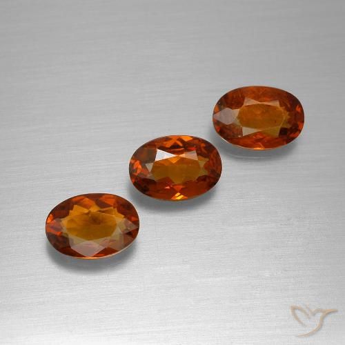 3 Stück/Set ovaler oranger Spessartin-Granat aus Mosambik - Größe 6,2 x 4,2mm, Gewicht 1,68 ct gesamt / Durchschn. je 0,56 ct, Mohs-Härte 6,5 - 7,5 Geeignet für den täglichen Gebrauch im Schmuck, Photo A