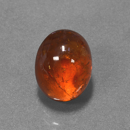 Dark Orange Spessartite Garnet Gem - 7.1ct Oval Cabochon (ID: 424328)