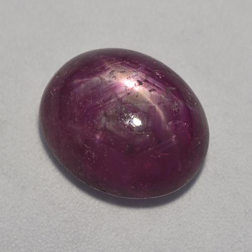 Medium-Dark Purple Звездчатый Рубин Камень - 7.5ct Овал Кабошон (ID: 527412)