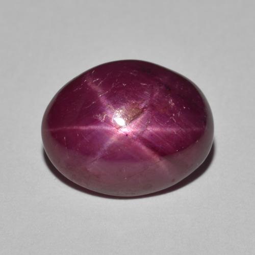 12.4 x 9.8mm Oval Red Star Ruby from Madagascar, Weight of 6.84ct, Natural heated Gemstone in Opaque Clarity, 1pc Oval Cabochon Star Ruby - Color: Dark Red, Mohs Hardness of 9 suitable for daily wear jewelry, Photo A