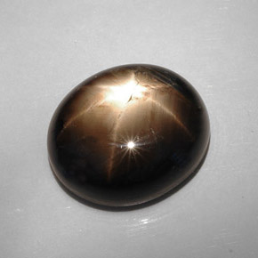 22.73 ct Black Star Sapphire Stone, Natural Star Sapphire in Oval Cabochon Shape for Sale