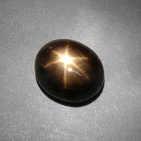 7.46 ct Black Star Sapphire Gemstone, Star Sapphire Gem in Oval Cabochon Shape for Sale.