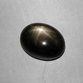 7.49 ct Black Star Sapphire Gemstone, Star Sapphire Gem in Oval Cabochon Shape for Sale.