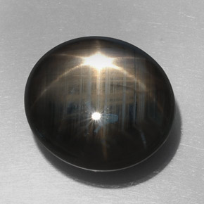 32.76 ct Black Star Sapphire Gemstone, Star Sapphire Gem in Oval Cabochon Shape for Sale.