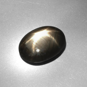 7.08 ct Black Star Sapphire Stone, Natural Star Sapphire in Oval Cabochon Shape for Sale