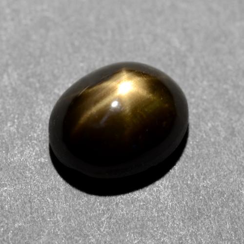 1.31 ct Black Star Sapphire Gemstone, Star Sapphire Gem in Oval Cabochon Shape for Sale.