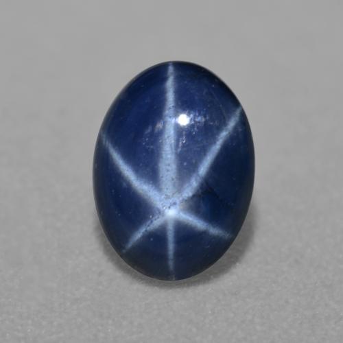 6.8 x 5mm Oval Cabochon Blue Star Sapphire from Thailand, Weight of 0.84ct, Natural diffused Gemstone in Translucent Clarity, 1pc Star Sapphire - Color: Dark Blue, Mohs Hardness of 9 suitable for daily wear jewelry, Photo A