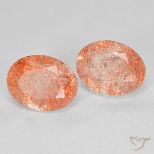 Par de Piedra del Sol Ovalada a juego de 8,1 x 6,2mm - Peso 2,85 ct en total / promedio. 1,43 ct cada uno, piedra preciosa natural No tratado, color Naranja rojizo con claridad Translúcido, dureza Mohs 6 - 6.5, Photo A