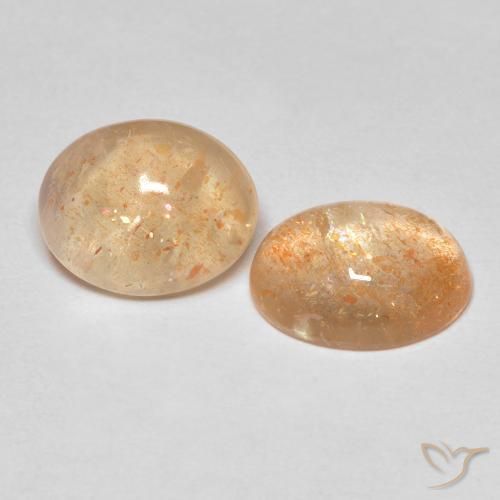 Par de Piedra del Sol Ovalada a juego de 10,3 x 8,4mm - Peso 5,18 ct en total / promedio. 2,59 ct cada uno, color Naranja durazno claro en claridad Translúcido, piedra preciosa natural No tratado, dureza de Mohs 6 - 6.5, Photo A