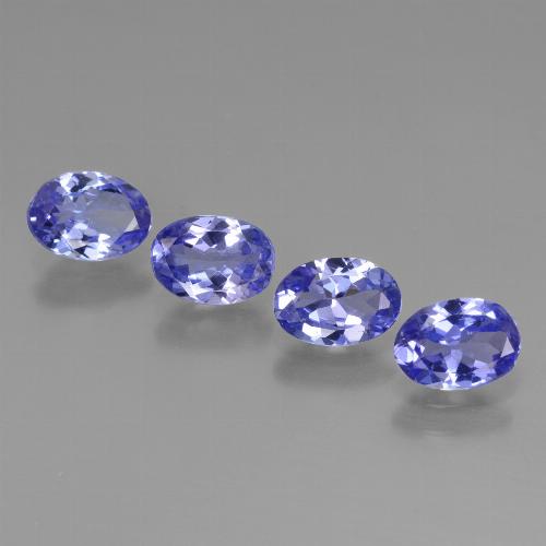 4pc Oval Facet Blue Tanzanite Lot from Tanzania - Weight 2.4ct total / avg. 0.6ct each, Size 6.4 x 4.5mm, Color: Intense Violet Blue, Mohs Hardness 6.5 - 7 suitable for daily wear jewelry, Only found in Tanzania, Photo A