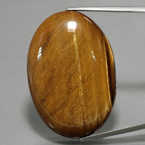 68.47 ct Brown Tiger's Eye Gemstone, Tiger's Eye Gem in Oval Cabochon Shape for Sale.