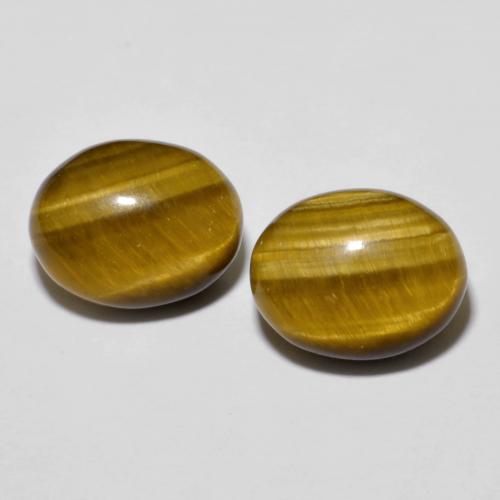2 pezzi Occhio di tigre taglio ovale abbinati di dimensioni 10,2 x 8,1mm, peso 6,26 ct totali / media. 3,13 ct ciascuno, Marrone giallastro in purezza Opaque, pietra preziosa naturale non trattati, durezza Mohs 6,5 - 7 adatto per gioielli da indossare ogni giorno, Photo A