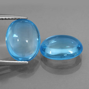 6.94 ct Blue Topaz Gemstone, Topaz Gem in Oval Cabochon Shape for Sale.
