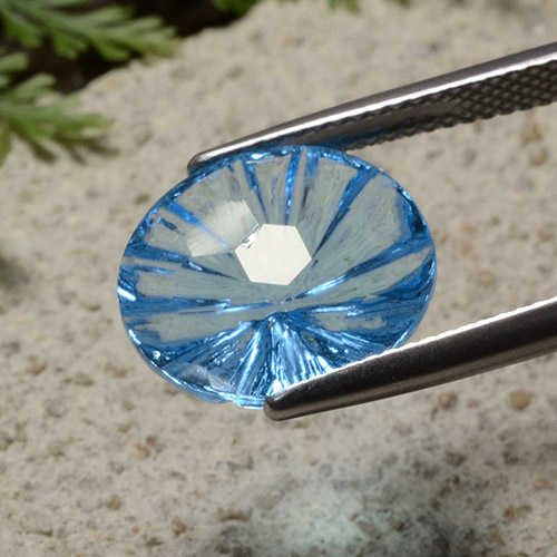 Свисс-Блю Топаз Камень - 6.8ct Oval Fantasy Concave Cut (ID: 485785)