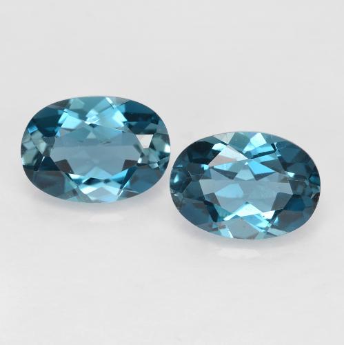 7.1 x 5mm Matching Oval Topaz Pair - Weight 1.86ct total / avg. 0.93ct each, Deep Navy Blue Color in VVS-VS Clarity, Natural Gemstone, Mohs Hardness 8 suitable for daily wear jewelry, Sagittarius Zodiac Stone, Photo A