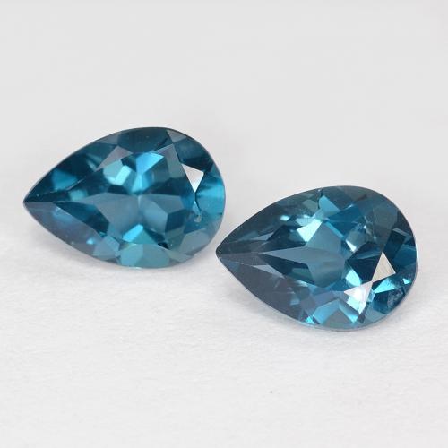 Matching Pair of 7 x 4.9mm Pear Facet Blue Topaz, Weight of 1.64ct total / avg. 0.82ct each, Matching Topaz Pair in VVS-VS Clarity in Deep Navy Blue Color, Natural irradiated gemstone, Mohs Hardness 8 suitable for daily wear jewelry, Year of the Horse Gemstone, Photo A