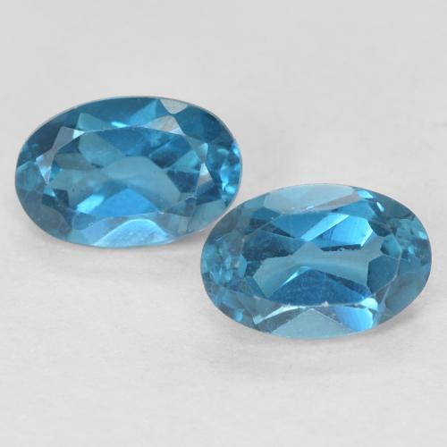 2 Stück ovaler blauer Topas in der Größe 6,1 x 4mm, Gewicht 1,17 ct gesamt / durchschn. Je 0,59 ct, London Blau in VVS Reinheit, Natürlicher Edelstein, Mohs-Härte 8 Geeignet für den täglichen Gebrauch im Schmuck , Freitag Edelstein, Photo A