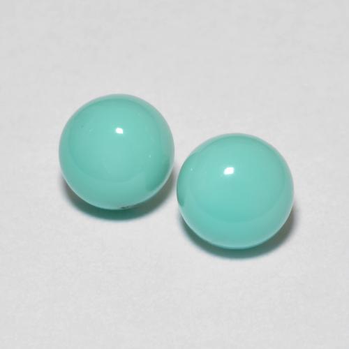 2pc Matching Round Turquoises in Size 5.1mm, Weight 1.32ct total / avg. 0.66ct each, Blue Green in Opaque Clarity, Natural untreated gemstone, Mohs Hardness 5 - 6, Photo A