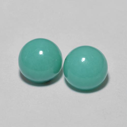 2pc Matching Round Turquoises in Size 5.1mm, Weight 1.28ct total / avg. 0.64ct each, Bluish Green in Opaque Clarity, Natural untreated Gemstone, Mohs Hardness 5 - 6, Photo A